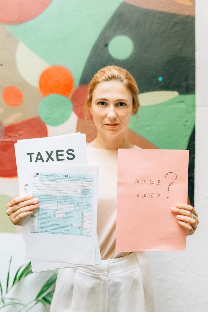 Woman Holding Pink and White Papers